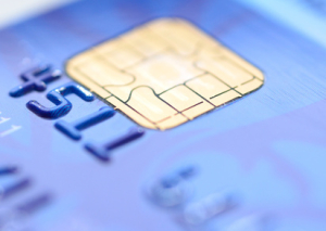 Closeup image of old blue credit card.
